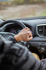 Man driving his car. Close up photo
