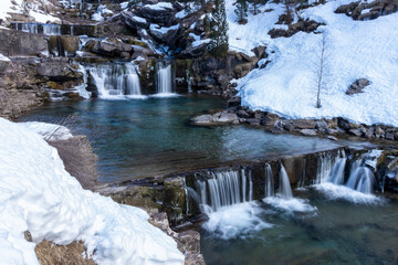 waterfall in ordesa national park in the spanish pyrenees in winter