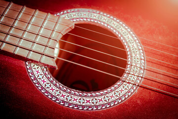 Guitar strings. Flamenco guitar. Music style background. Photo of an acoustic guitar in dark...