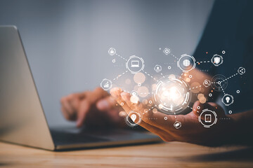 Business man use laptop with cloud computing diagram show and pen on hand. Networking and internet service concept.