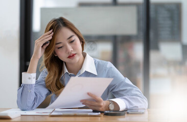 Asian women are bored from their online studies, have a sad face and have been tired from their studies for a long time.