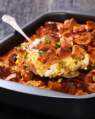 Scalloped Chicken Casserole topped with croutons