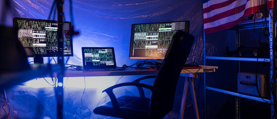 Internet hacker workplace in dark office, cyberwar concept.