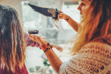 incense in a woman hand, ceremony space.