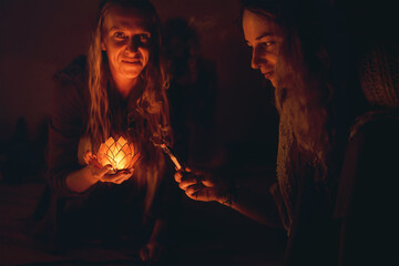 incense in a woman hand, ceremony space.