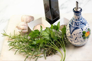 Fresh herbs prepped with garlic and olive oil