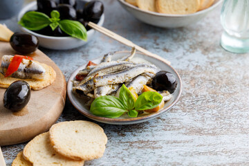 anchovy appetizer with olives.