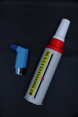 A peak flow meter with an inhaler medicine. A peak flow test is used in the treatment of asthma to...