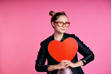 Caucasian teenage girl with heart shape speech bubble and red glasses