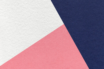 Texture of craft navy blue, white and pink shade color paper background, macro. Vintage abstract indigo cardboard