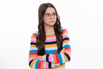 Portrait of young teenage girl standing with crossed arms against white background with copy space.