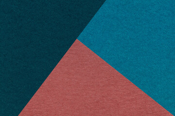 Texture of craft navy blue, cerulean and maroon shade color paper background, macro. Vintage abstract cardboard.