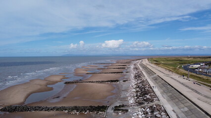 Aerial view of the coast with  sea and blue sky and buildings and houses. Taken in Fleetwood Lancashire England.  © ReayWorld