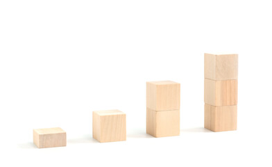 Business concept growth success process, statistics graph. Wooden blocks stacking as an arrow up averages as a growth graph chart on white background.