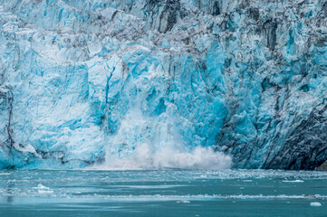 A view of calving from the snout of the Marjerie Glacier in Glacier Bay, Alaska in summertime