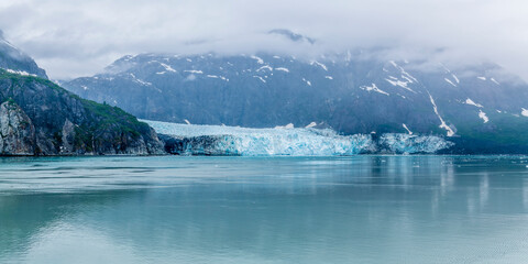 A view of mist descending upon the Marjerie Glacier in Glacier Bay, Alaska in summertime