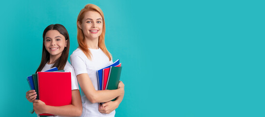 Mother and daughter child banner, copy space, isolated background. private teacher and child holding copybooks. family help. mother and daughter hold notebook.