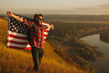Happy male tourist with USA flag