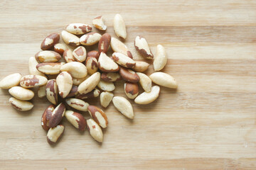top view of Brazilian nuts on wooden background 