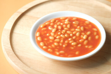 Tasty baked beans in a bowl on table 