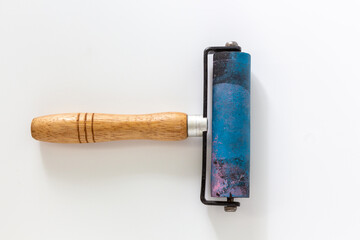 Rubber brayers with wooden hand held use in craft process on white background in top view. - obrazy, fototapety, plakaty