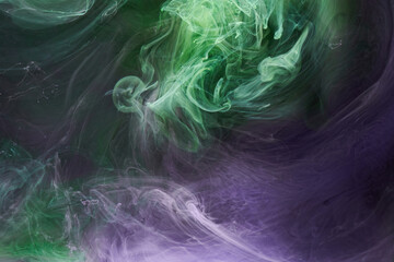 Green purple smoke abstract background, acrylic paint underwater explosion