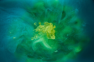 Liquid fluid art abstract background. Blue green acrylic paint underwater, galactic smoke ocean