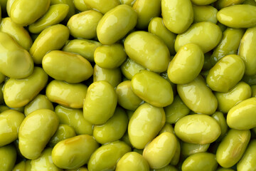 Preserved steamed edamame beans close up full frame as background