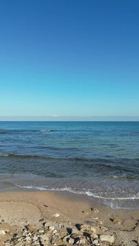 Sea waves gently crash on the beach coast. Givat Alia, Jaffa, Israel. High quality 4k footage