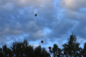 Balloons over the forest.