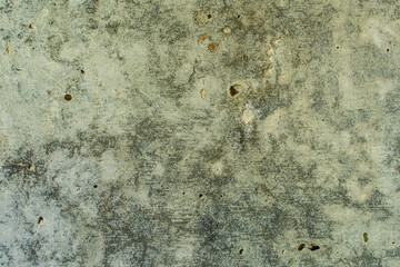Texture of concrete with a crack in the middle. Close-up. Inclusions of sand of different colors. Old cracked surface. Small details of sand creating a noise effect.