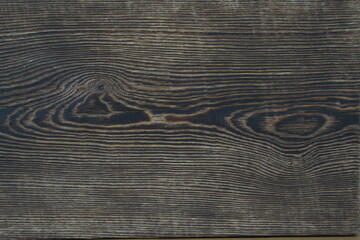 Aged, burned rustic braun dark pine wood texture. Boards with a knot. Grunge rough texture, wood texture. Scorched aged plank.