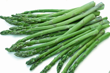 Fresh green asparagus isolated on white background,flat lay.