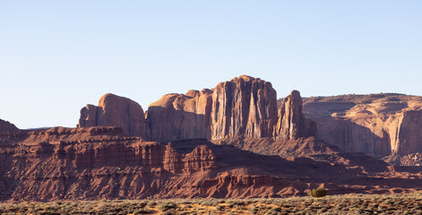 Fototapeta premium Desert Rocky Mountain American Landscape. Morning Sunny Sunrise Sky. Oljato-Monument Valley, Utah, United States. Nature Background