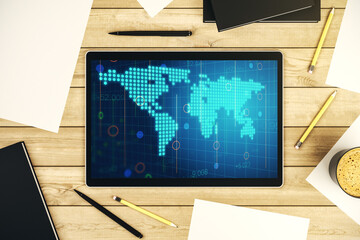 Abstract creative world map on modern digital tablet screen, international trading concept. Top view. 3D Rendering