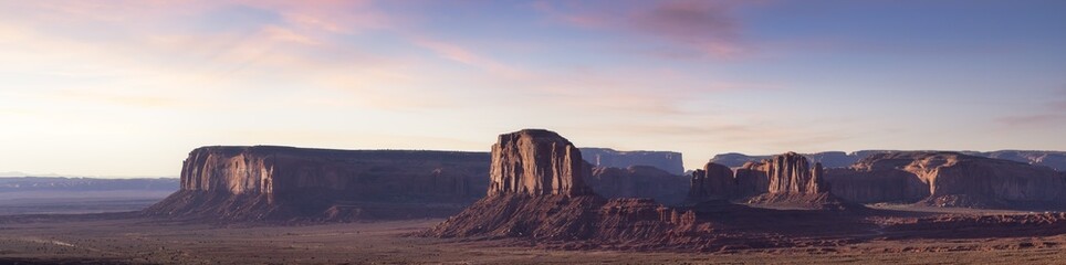 Fototapeta na wymiar Desert Rocky Mountain American Landscape. Morning Sunny Sunrise Sky Art Render. Oljato-Monument Valley, Utah, United States. Nature Background Panorama