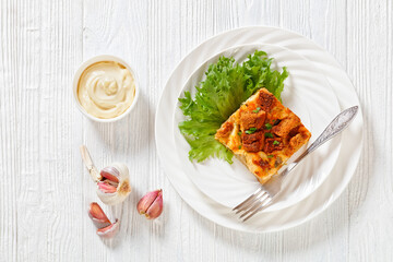 Scalloped Chicken Casserole topped with croutons