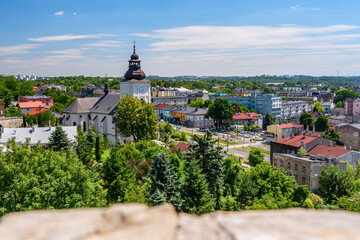 Castle in Bedzin, a view from the top of the castle tower to the vast urban landscape. Summer sunny day.