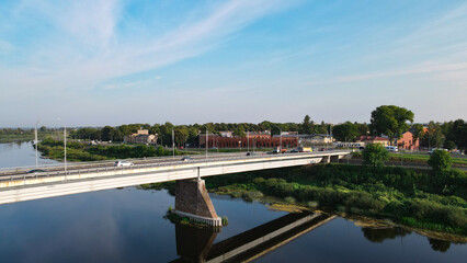 Vienibas bridge and Daugavpils city view on the river Daugava in summer time.