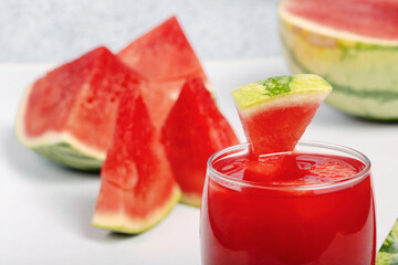 A glass of watermelon juice on a white background.