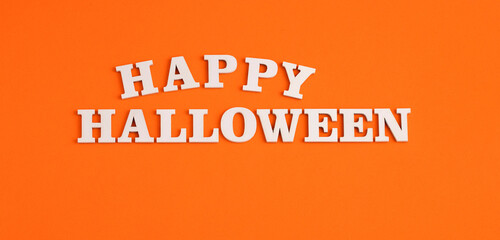 Fototapeta na wymiar Word Halloween in white letters on orange background