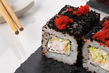 rolls with flying fish caviar close-up, top view