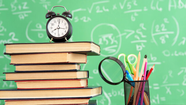 School books and pencils on desk, education concept