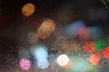 Blurred background with raindrops and lights.