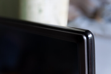 the corner of the flat-screen TV. Selective focus
