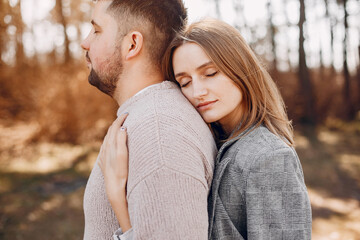 Beautiful couple spend time in a summer park