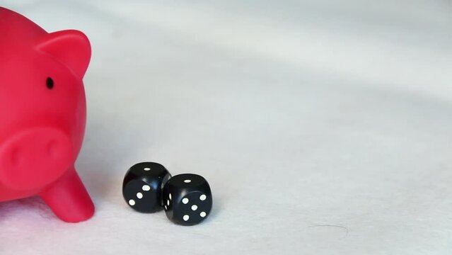 Piggy bank and dice. Multicurrency savings. Risk while saving money.