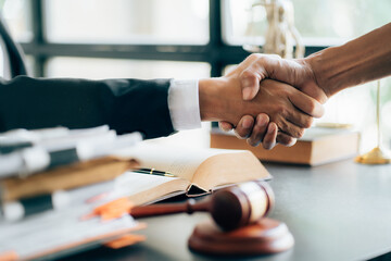 justice and law concept.Male judge in a courtroom on wooden table and Counselor or Male lawyer...