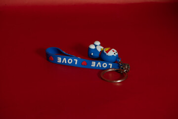 a keychain on a red background