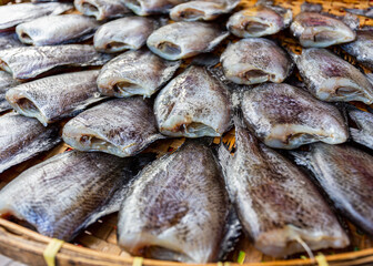 Pattern of Sun dried salted fish in bamboo plate